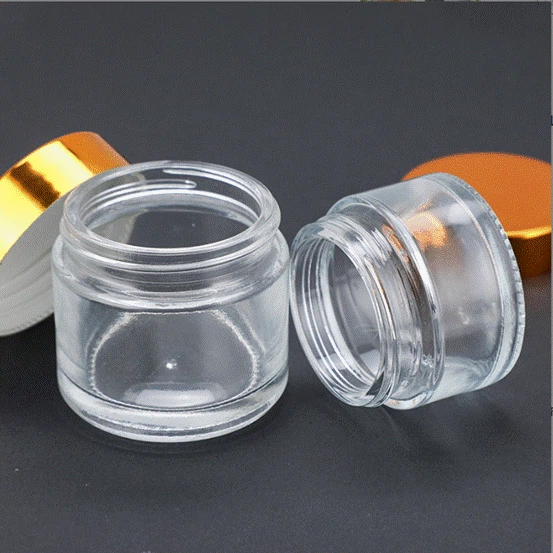 Bouteille de crème en verre transparent